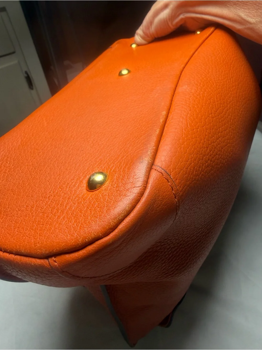 Structured Orange Leather Satchel with Top Handle and Crossbody Strap